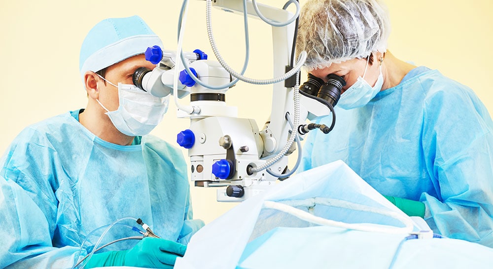 Eye surgeons performing LASIK surgery