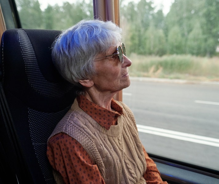 Older woman riding the bus