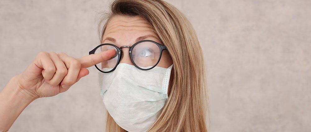 Glasses and face mask worn by woman, eye care at Assil Gaur Eye Institute, Ophthalmology services in US.