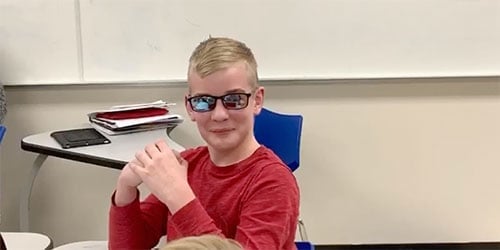 Young boy with eye glasses at Assil Gaur Eye Institute.