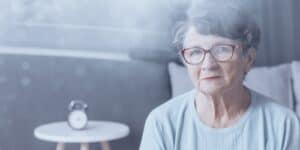 Highly experienced elderly woman with glasses at Assil Gaur Eye Institute for advanced eye treatment.