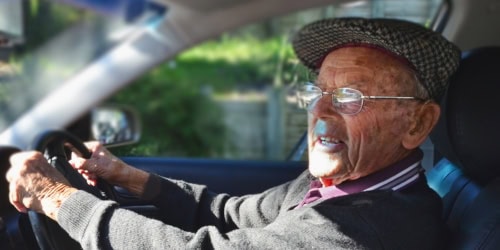 Elderly man driving, eye health focus, Assil Gaur Eye Institute expert care.