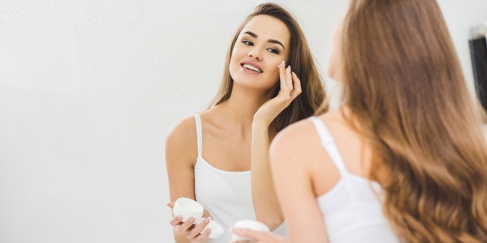 Close-up of a smiling woman in an eye care consultation.