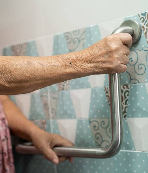 Elderly falls prevention with grab bar installation at Assil Gaur Eye Institute.