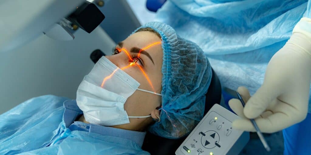 Patient undergoing laser eye surgery procedure with advanced laser technology and sterile environment.
