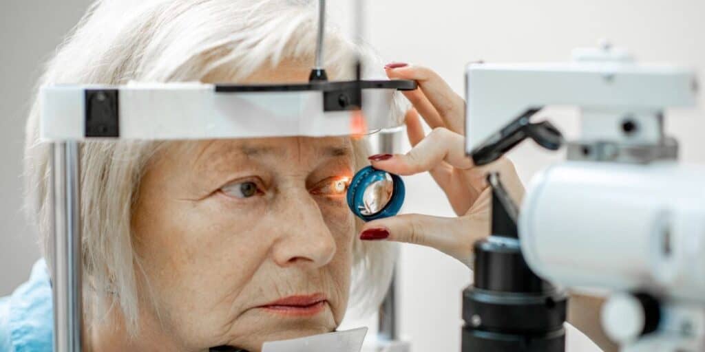 Panoramic view of senior woman undergoing a comprehensive eye exam at Assil Gaur Eye Institute, highlighting expert ophthalmology services.
